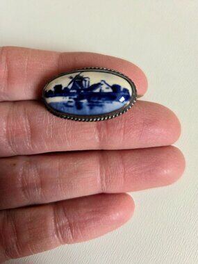 Vintage Dutch porcelain and silver 835 windmill cameo oval brooch.  1'' long.